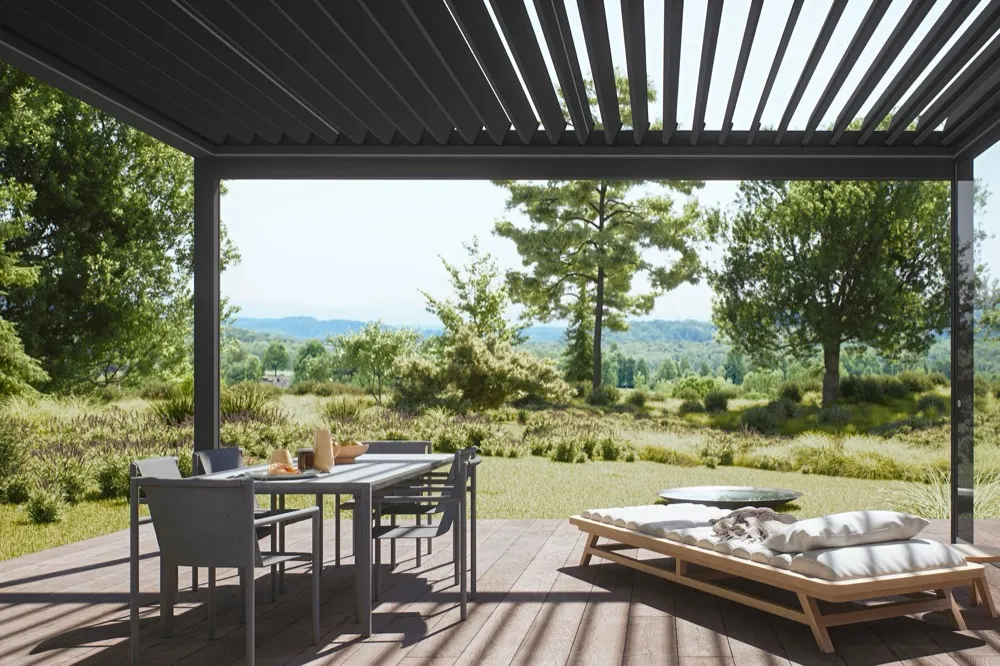 Pergola STOBAG à lames au-dessus d'une terrasse avec vue sur la campagne